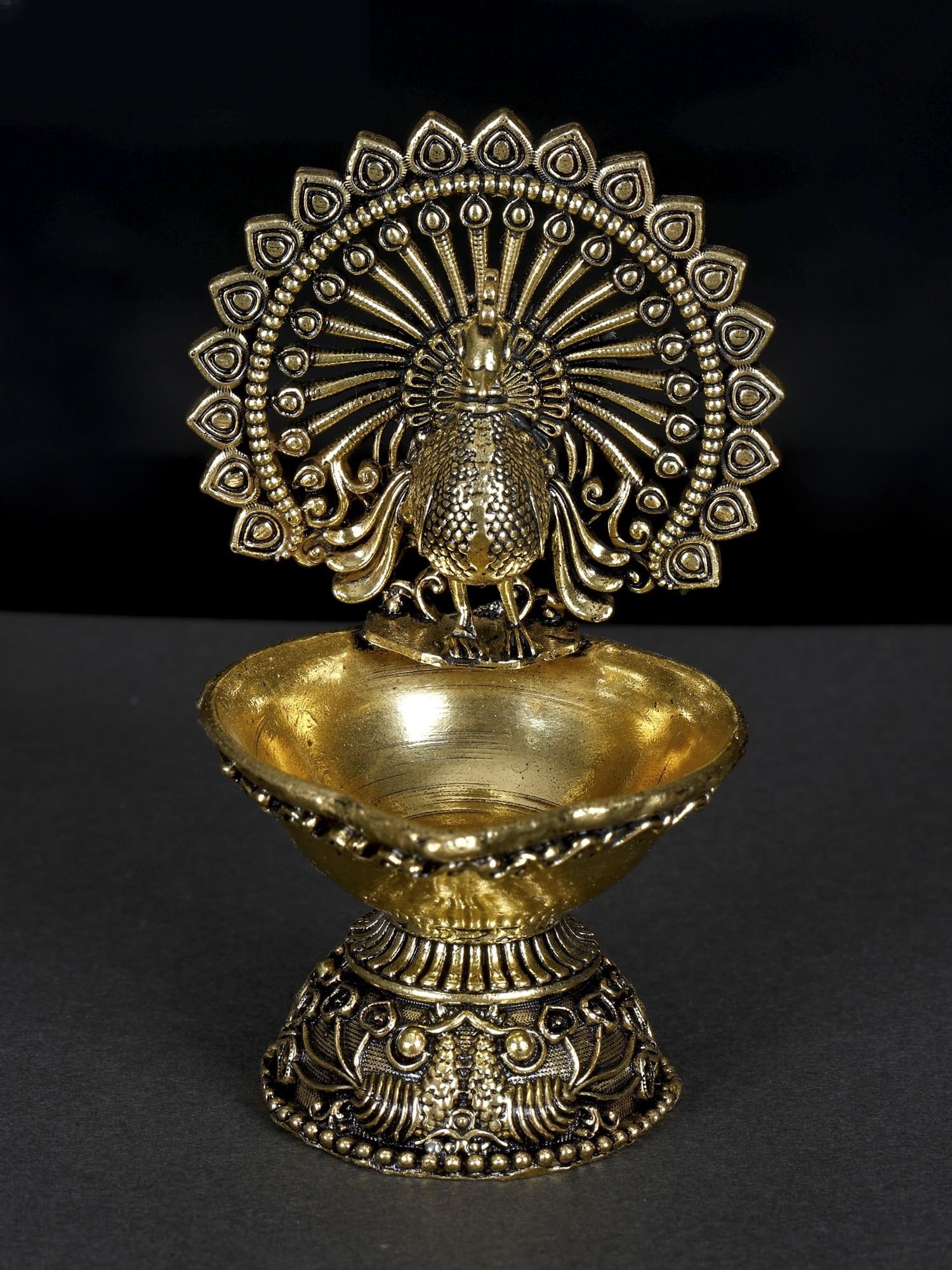 4" Small Superfine Designer Peacock Diya in Brass: Title: 4" Small Superfine Designer Peacock Diya in Brass Additional Information: itemcode: DDN621 Reserve: $47.00 Shipping: Domestic: Shipping rates are determined by destination International: