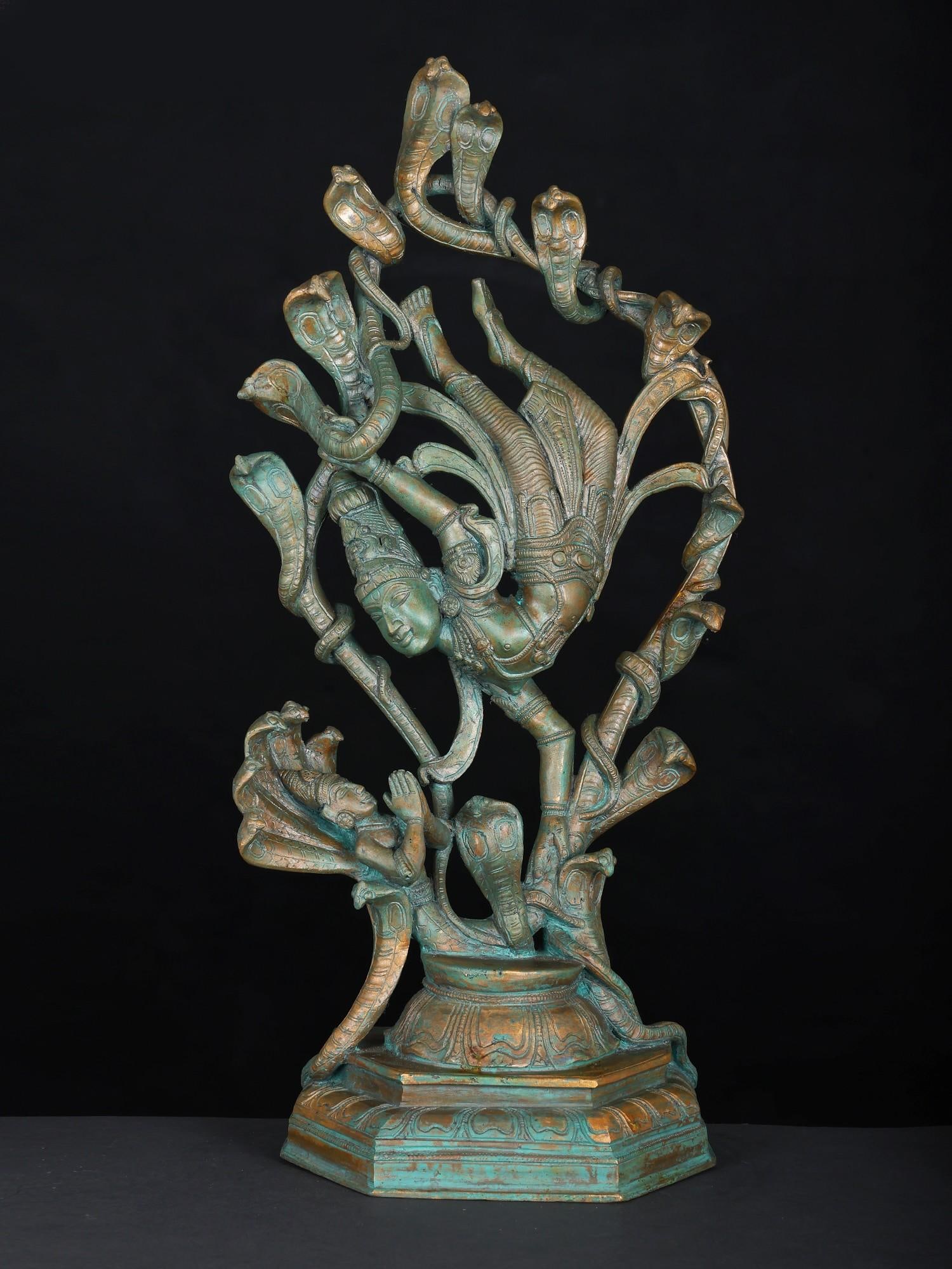 17" Kaliya Narthana Krishna Bronze Statue: Title: 17" Kaliya Narthana Krishna Bronze Statue Description: An awe-inspring visual version of the Krishna-Lila of Kaliya-Mardan (vanquishing the serpent Kaliya), this sculpture blends the heritage