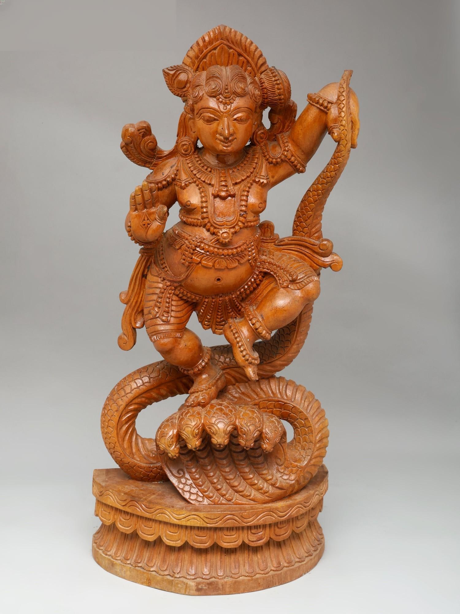 26" Lord Krishna Dancing on Kaliya Naag | Wood Carving: Title: 26" Lord Krishna Dancing on Kaliya Naag | Wood Carving Additional Information: itemcode: DDO669 Reserve: $491.00 Shipping: Domestic: Shipping rates are determined by destination International: 