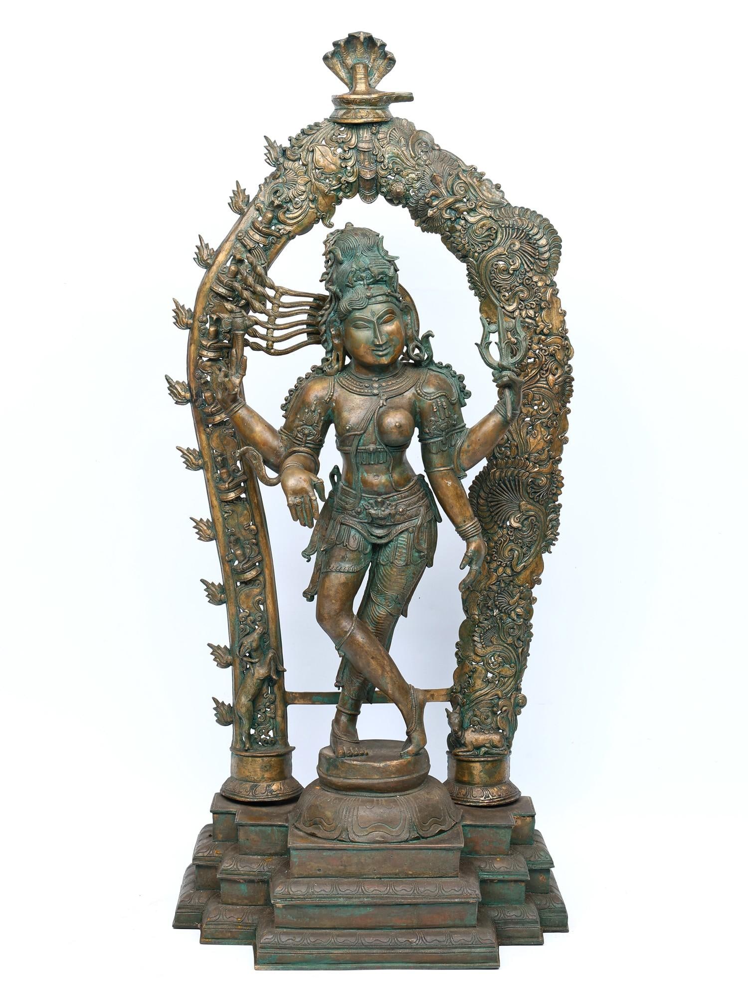 44" Ardhanarishvara (Shiva-Shakti) with Carved Prabhavali | Bronze Statue: Title: 44" Ardhanarishvara (Shiva-Shakti) with Carved Prabhavali | Bronze Statue Additional Information: itemcode: DDN937 Reserve: $6,722.00 Shipping: Domestic: Shipping rates are determined by destin