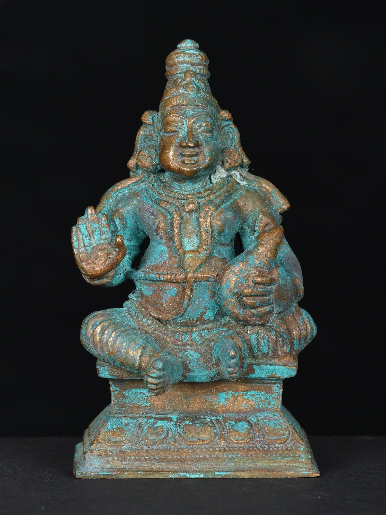 3" Small Lord Kubera Bronze Statue: Title: 3" Small Lord Kubera Bronze Statue Description: Yaksharaja (King of Yakshas) Kubera is presented as a plump, royal, divine being in this small bronze icon. Kubera sits on a lotus throne in the