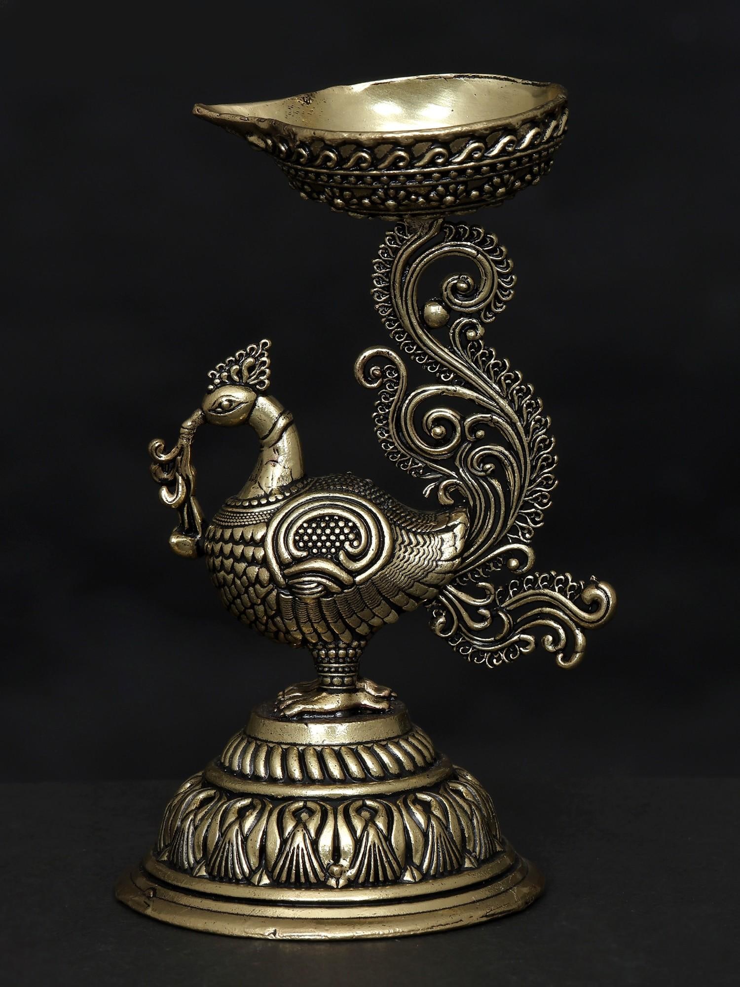 5" Small Superfine Peacock Diya in Brass: Title: 5" Small Superfine Peacock Diya in Brass Additional Information: itemcode: DDN620 Reserve: $57.00 Shipping: Domestic: Shipping rates are determined by destination International: Foreign