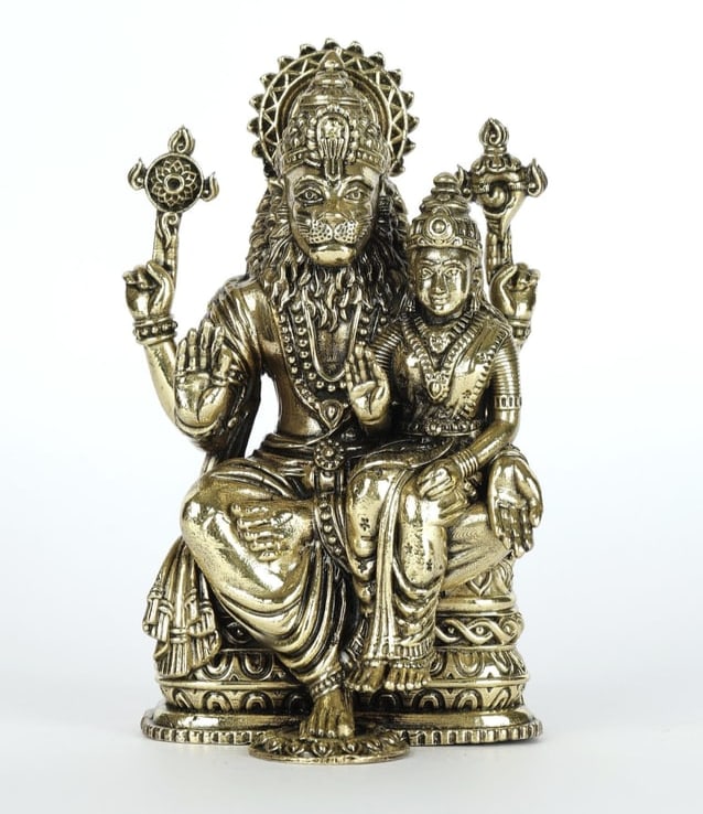 4" Small Superfine Sitting Lord Narasimha with Devi Lakshmi Brass Statue: Description: This Superfine Lakshmi-Narasimha brass statue captures a serene moment of the man-lion Vishnu, a stark contrast to his fierce descriptions in the Puranas. Narasimha's tranquility comes