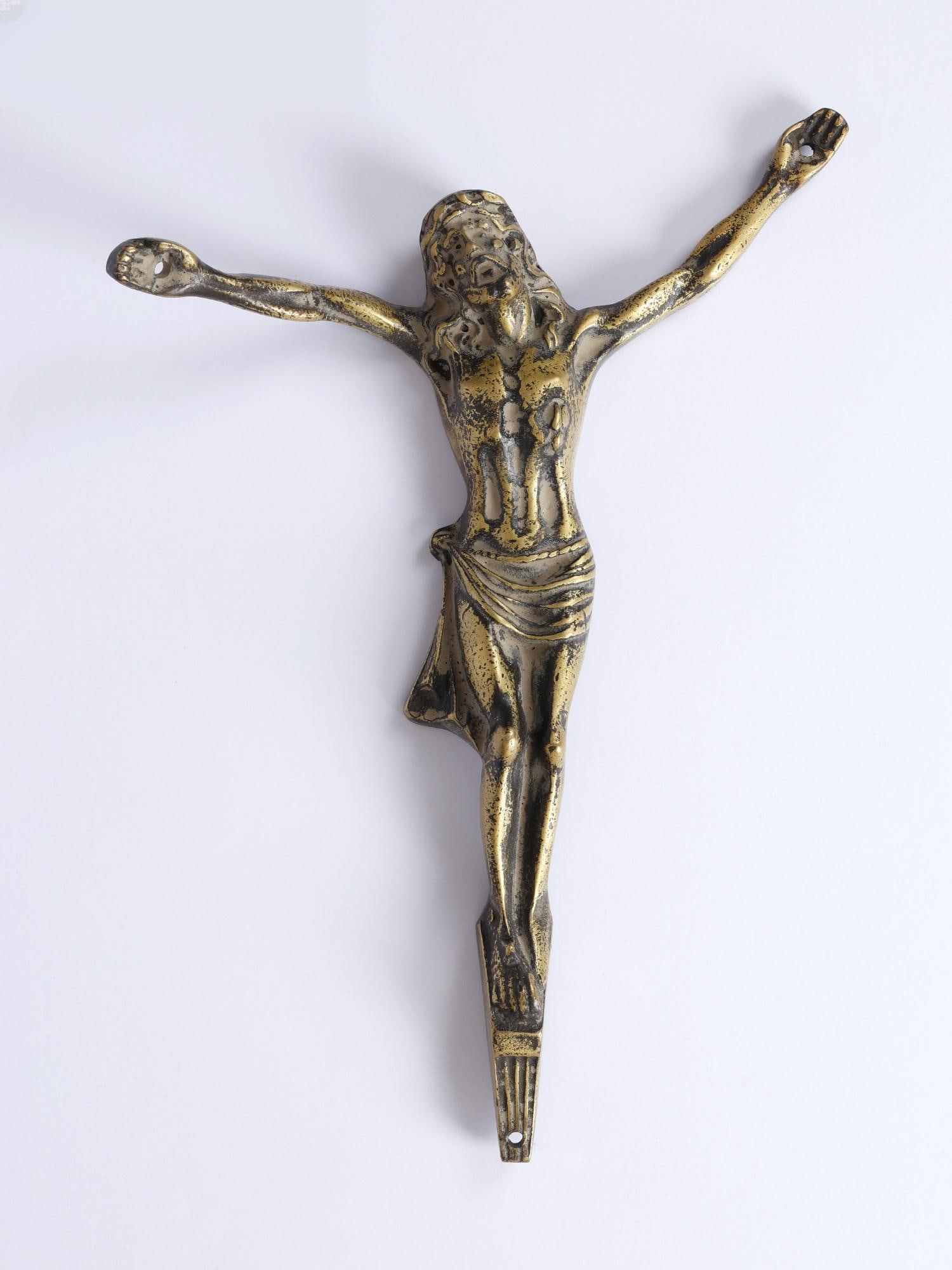 11" Brass Jesus Christ /Vintage Wall Hanging Statue: Description: A Jesus Christ wall hanging made with brass is a deeply meaningful and artistic representation of faith, love, and sacrifice. This elegant piece of decor serves as both a visual reminder 