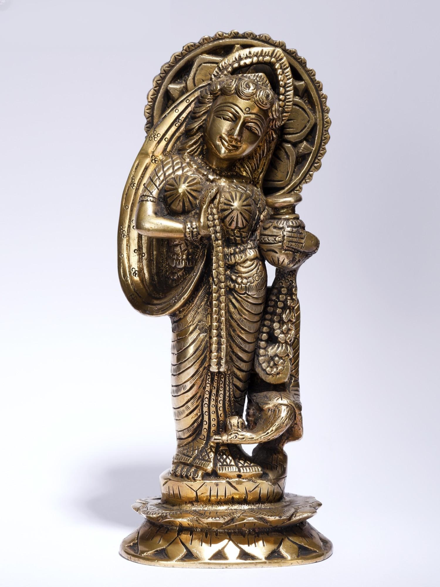 9" Goddess Radha with Matki /Brass Statue: Description: --- Additional Information: itemcode: DDM418 Reserve: $140.00 Shipping: Domestic: Shipping rates are determined by destination International: Foreign shipping rates are determined by