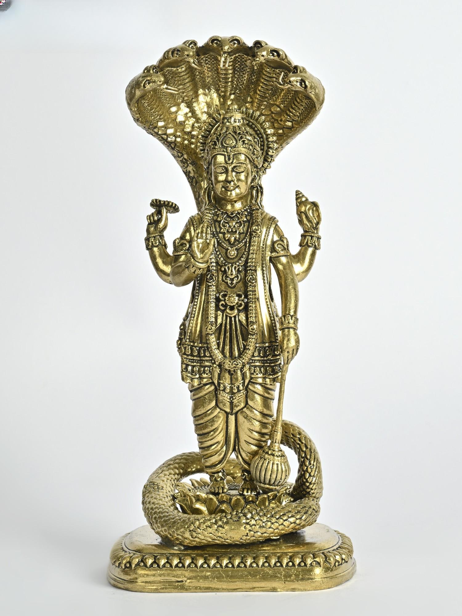 Superfine Standing Lord Vishnu Brass Statue Under Sheshnag: Description: In a few centimeters, the sculptor of this brass statue has infused the essence of the Universe, by presenting the Paalankarata, the preserver of the creation, Lord Vishnu. Five hoods of