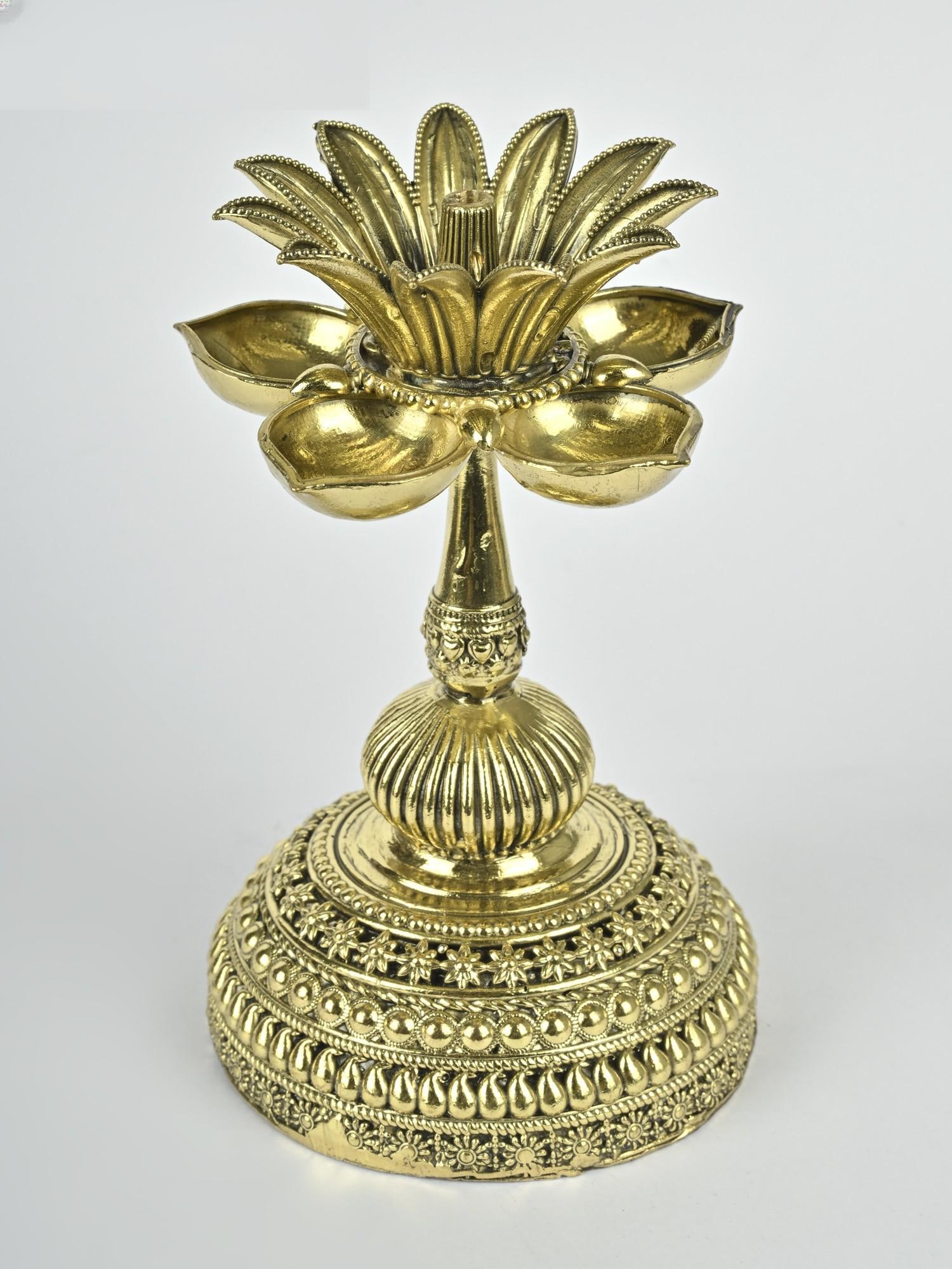 5" Superfine Designer Oil Lamp in Brass /Spiritual Ritual Decor: Description: With its intricate appeal and immaculate sculpting, this designer brass lamp lights up the space before you light the Diya. A most appealing element in the lamp is the floral pattern