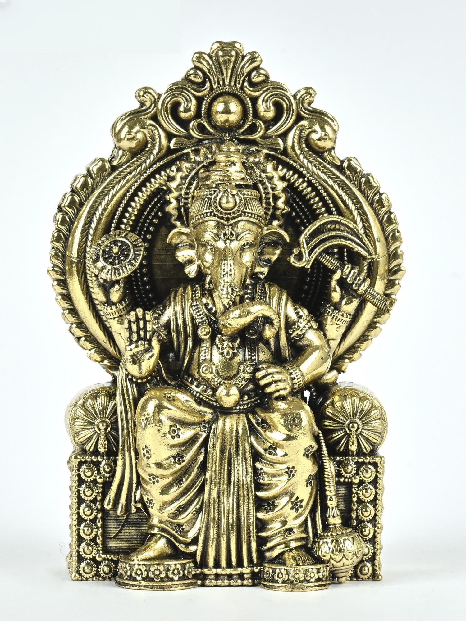Small Superfine Lalbaugcha Raja Ganesha Brass Statue: Description: A perfect representation of the humongous statue of Lalbaugcha Raja, this superfine Ganesha icon ideally captures the aura of Ganapati in its miniature make. The exquisite brass icon capt