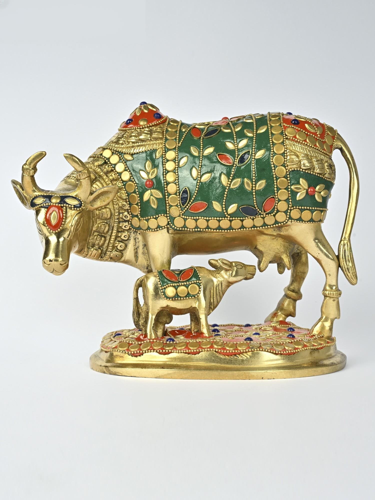 8" Brass Cow and Calf with Inlay Work /Spiritual Home Decor: Description: In Vaastu, Kamadhenu with her calf is revered as a symbol of abundance, prosperity, and good fortune. This brass statue captures the divine essence of this sacred pair. The rich, warm
