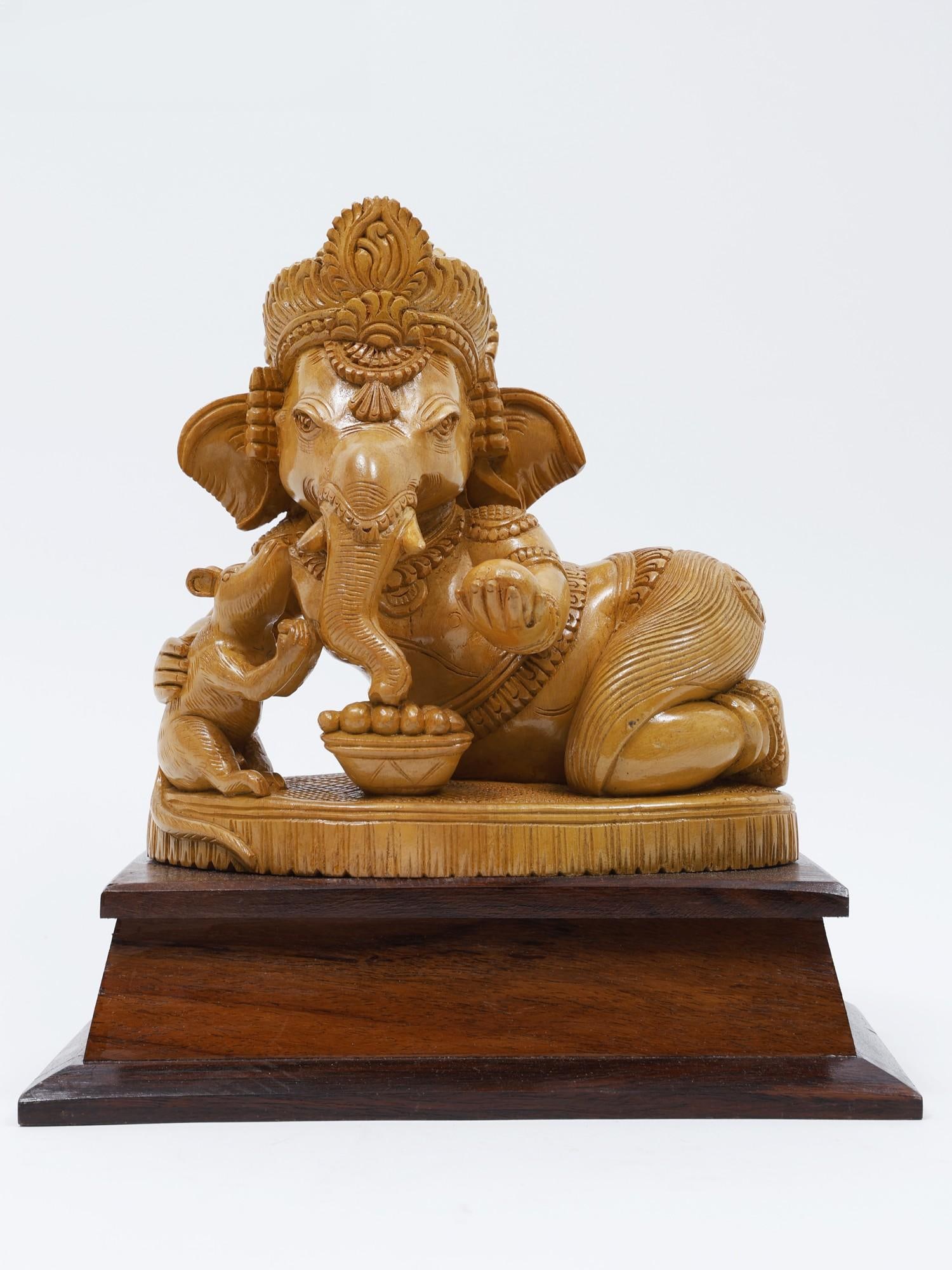 11" Bal Ganesha Eating Modak with Mushak /Wood Carved Statue: Description: --- Additional Information: itemcode: DDM692 Reserve: $337.00 Shipping: Domestic: Shipping rates are determined by destination International: Foreign shipping rates are determined by dest