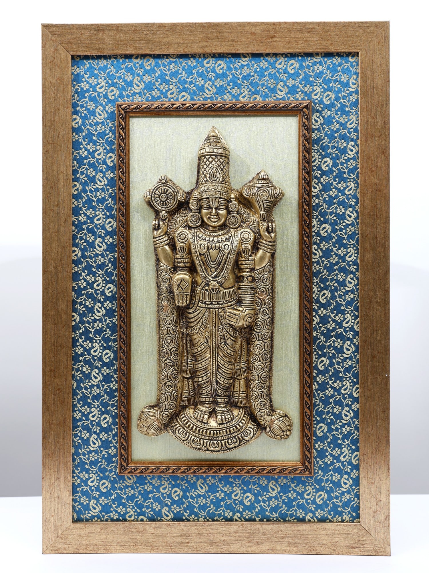 21" Tirupati Balaji (Venkateshvara) /Wood Framed Brass Sculpture /Wall Hanging Decor: Description: This magnificent wall hanging captures the revered form of Lord Venkateshvara, symbolizing wealth, prosperity, and protection. Intricately crafted from brass, the sculpture showcases exqu