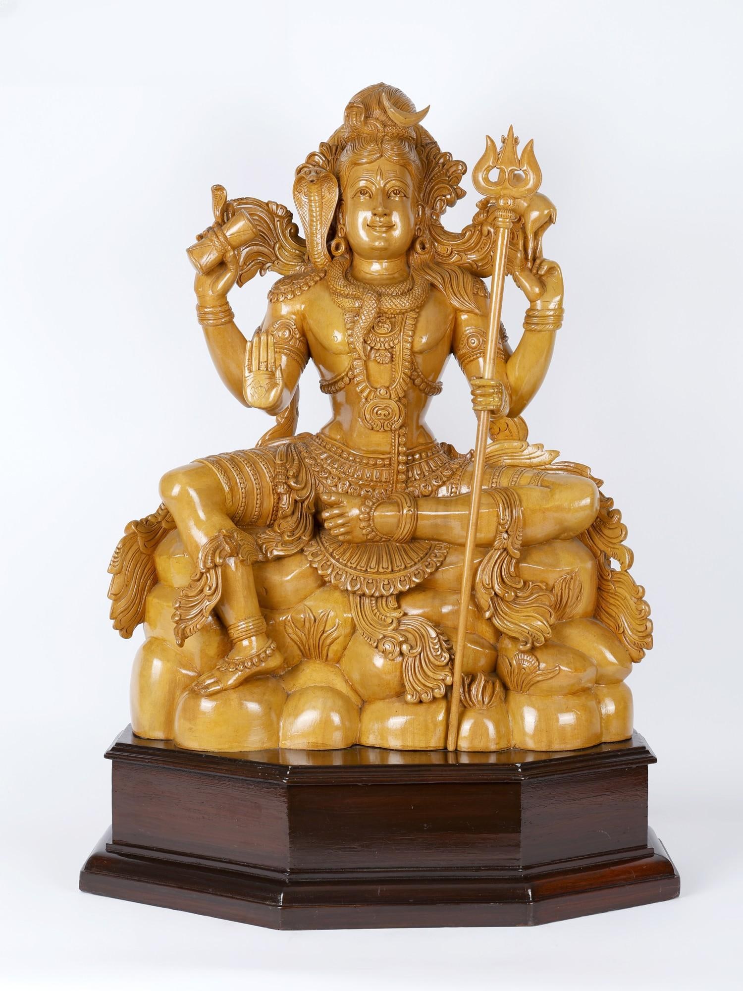The Brilliant Lord Shiva: Description: Shiva, handsome as only He can be, sits on Mount Kailash wielding a long trident. With His main right hand he blesses His devotees. There is a damaru in His right back hand. It was from t