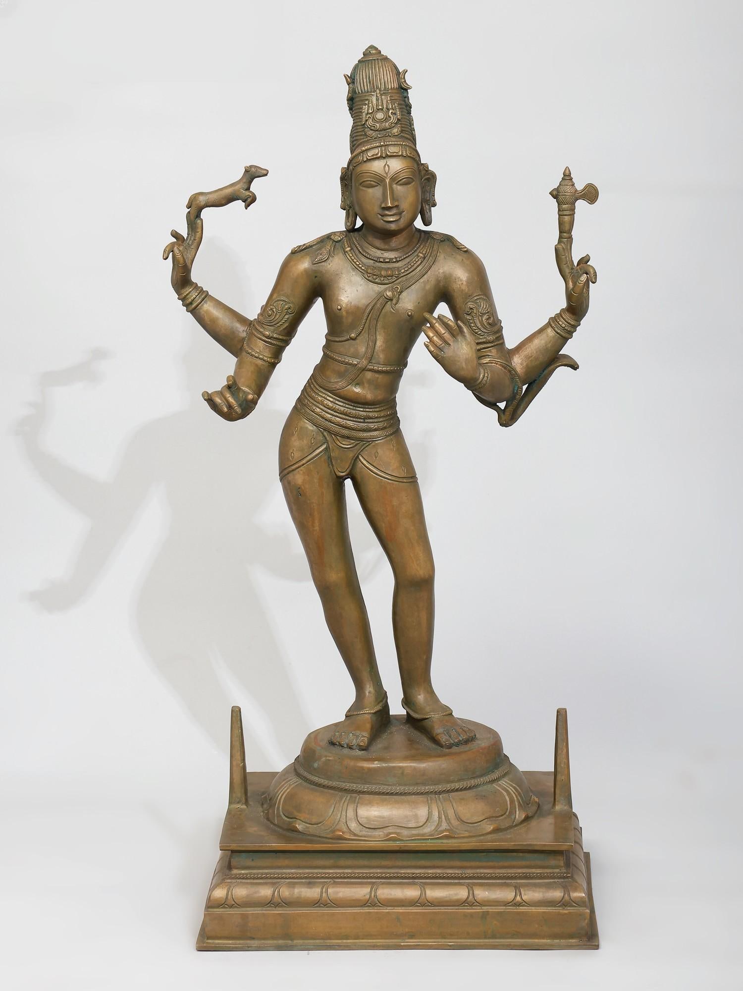 24" Veenadhara Shiva /Madhuchista Vidhana (Lost-Wax) /Panchaloha Bronze from Swamimalai: Description: Shiva is the primal instructor or Guru in his Dakshinamurty Roopa, one of whose iconographic depictions is Shiva-Veendhara (Shiva with the Veena or lute, which is often absent from the cl