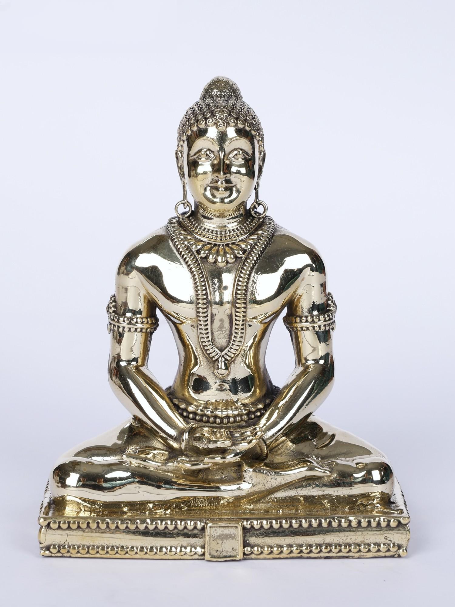 4" Superfine Mahavir Jain Brass Statue: Description: A radiance associated with transcendental personas emanates from this exquisite icon of Mahavira, the 24th Tirthankara of Jainism. Perfect curls, rich jewelry, and animated face- Intricat