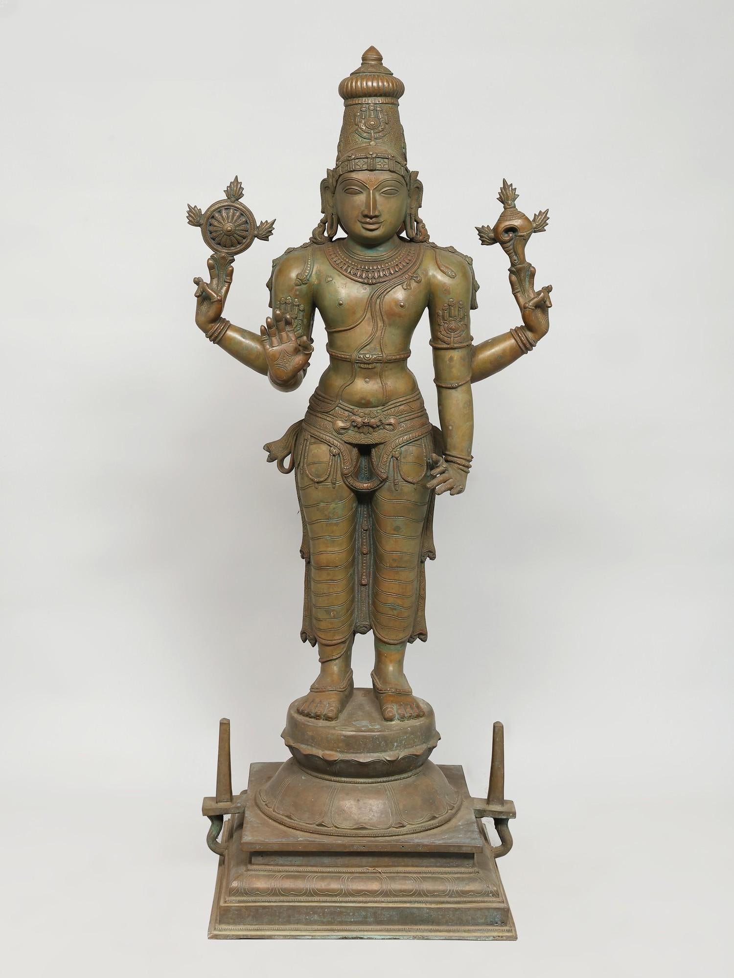 43" Large Standing Four-Armed Lord Vishnu /Madhuchista Vidhana (Lost-Wax) /Panchaloha Bronze from: Description: Vishnu is "Vishwadhara"- the foundation of the cosmos, an idea represented in his classic depiction in Chola bronzes, where the Hindu gods stand in an erect, upright, and graceful pose- S