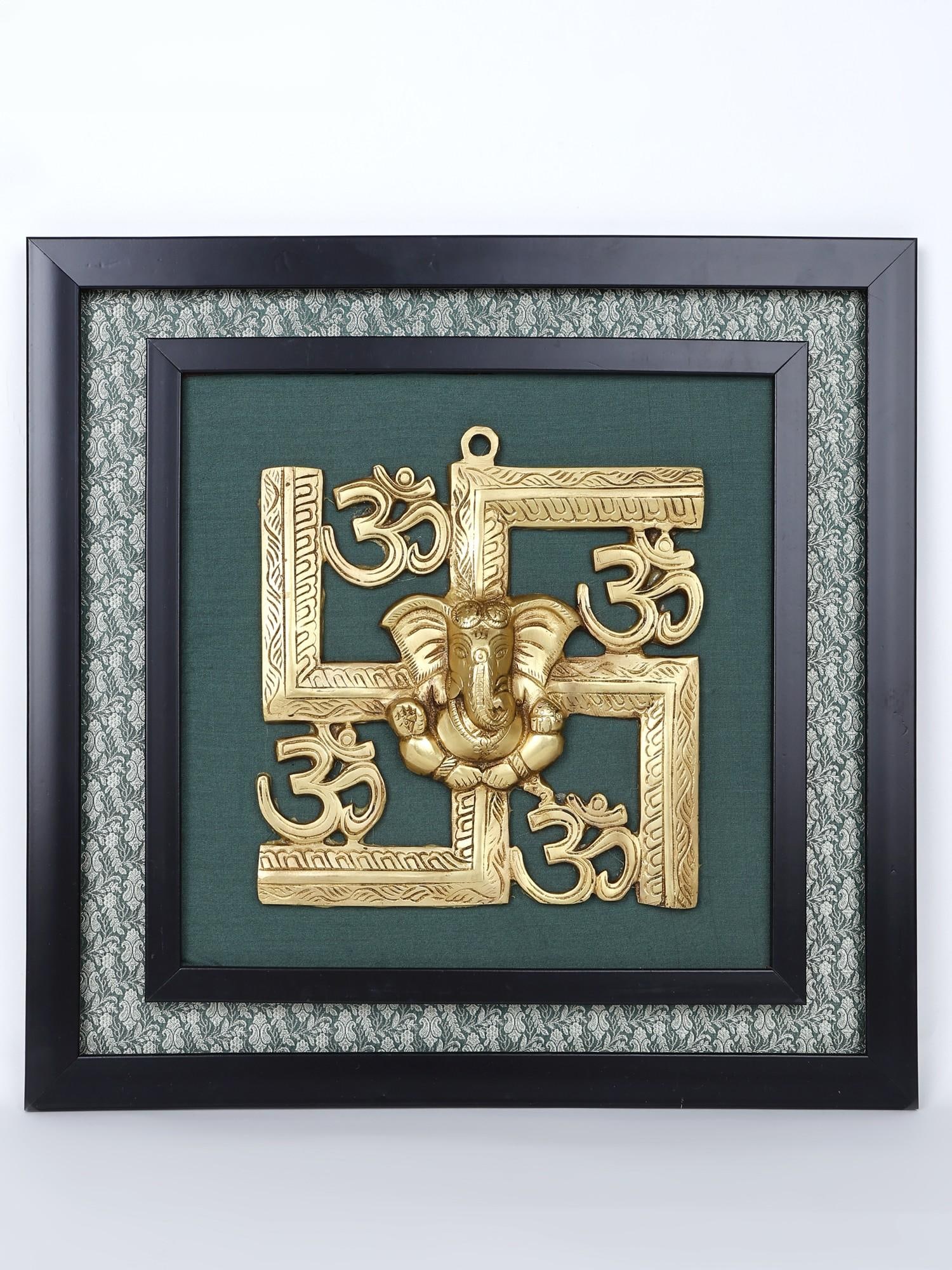 17" Blessing Lord Ganesha with Hindu Symbols Om and Swastik /Wall Hanging Wood Framed Brass: Description: Ganesha is frequently linked to Swastika and Om in Hindu sacred art, the three are seen as ancient and powerful symbols of auspiciousness and divinity. This wall hanging represents the sa