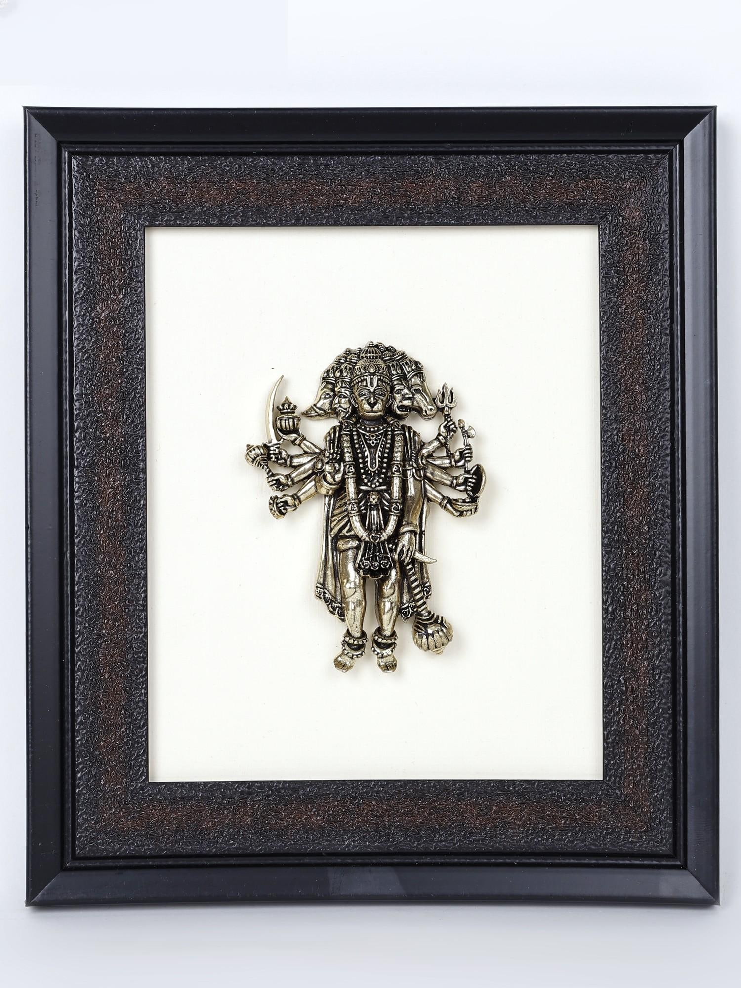 9" Superfine Standing Ten Armed Panchamukhi Hanuman /Wall Hanging Wood Framed Brass Sculpture: Description: Panchamukhi Hanuman is the supreme guardian of the devotees, a potent aspect of the Lord, which dispels negativity and empowers the heart. The superfine icon of Panchamukhi Hanuman stands