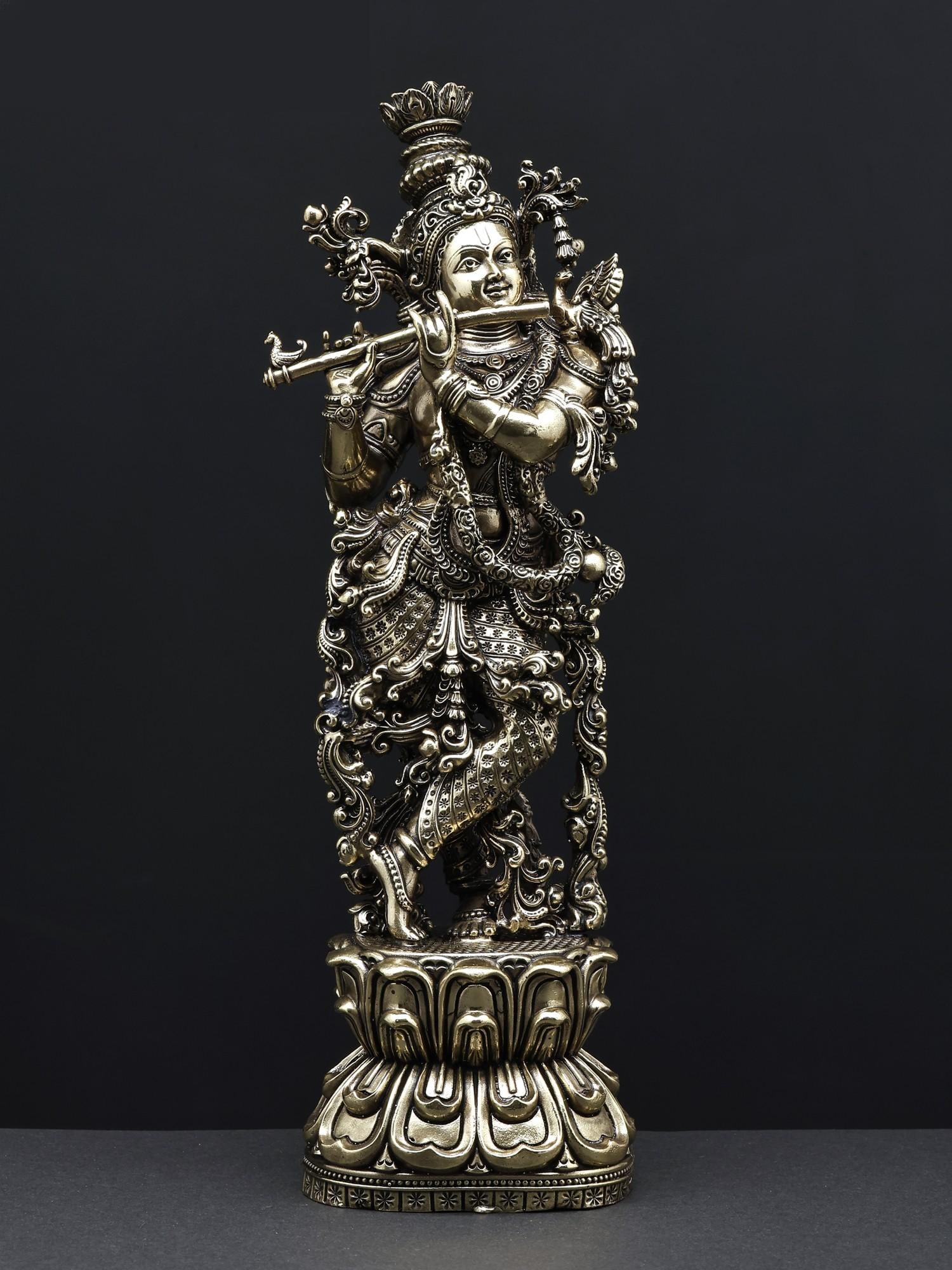 Superfine Fluting Lord Krishna Brass Statue: Description: The most beautiful statue of the most beautiful Lord Krishna, this superfine brass icon is an eternal darshana of Murlidhara, playing his flute in your space. As if sculpted by the