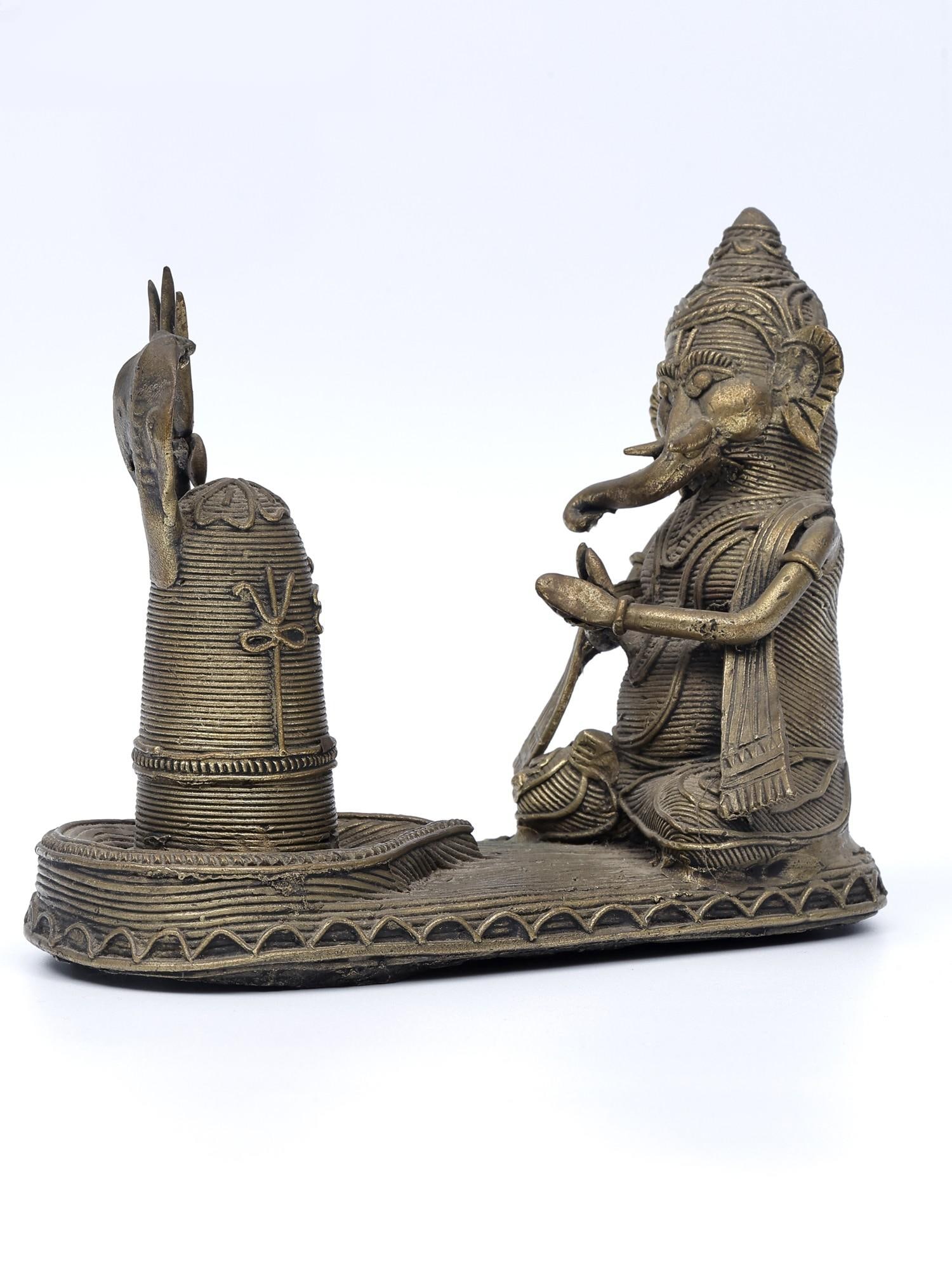 6" Lord Ganesha Worshipping Shiva Linga /Tribal Brass Statue: Description: --- Additional Information: itemcode: DDN366 Reserve: $171.00 Shipping: Domestic: Shipping rates are determined by destination International: Foreign shipping rates are determined by
