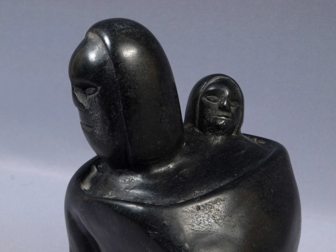 Signed Inuit Native American Soapstone Mom Mother baby Canada LOUIE ARNAYUIRNAAQ: This is a vintage Primitive Native American Eskimo Inuit Figurine. It is signed at the bottom with syllables. It is made by LOUIE ARNAYUIRNAAQ from Baker Lake The figurine is made from black soapstone
