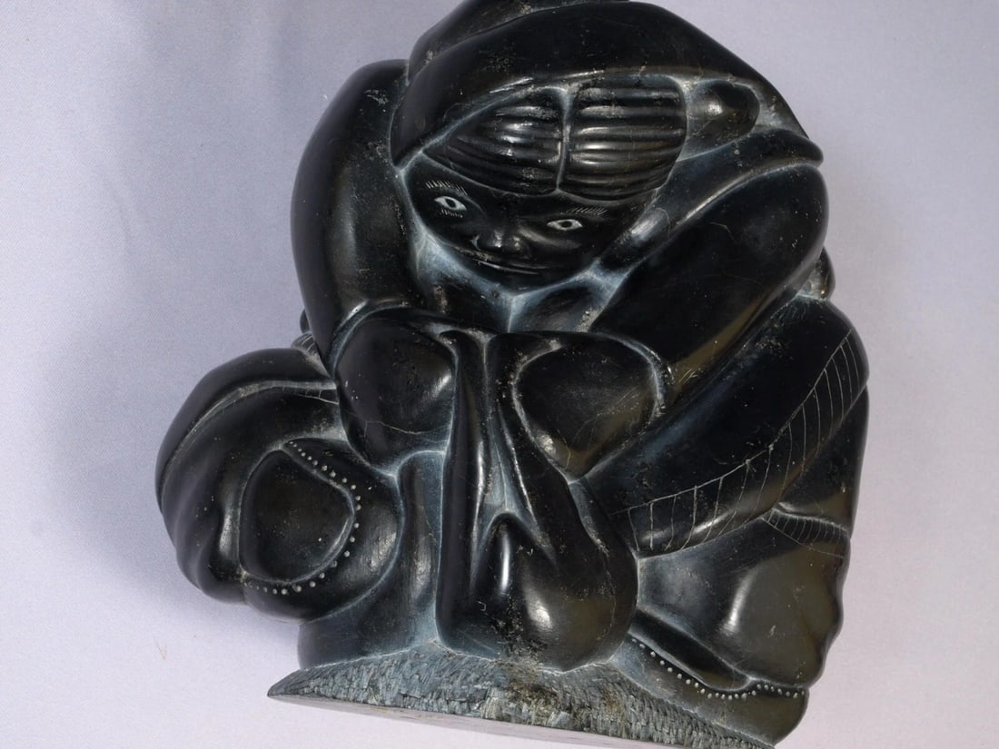 Canadian VINTAGE Inuit Eskimo Native American Soapstone Woman Animal: This is a vintage Primitive Native American Eskimo Inuit Figurine. The figurine is made from soapstone and is very beautiful. The figurine shows a native woman holding an animal, probably a seal. The 