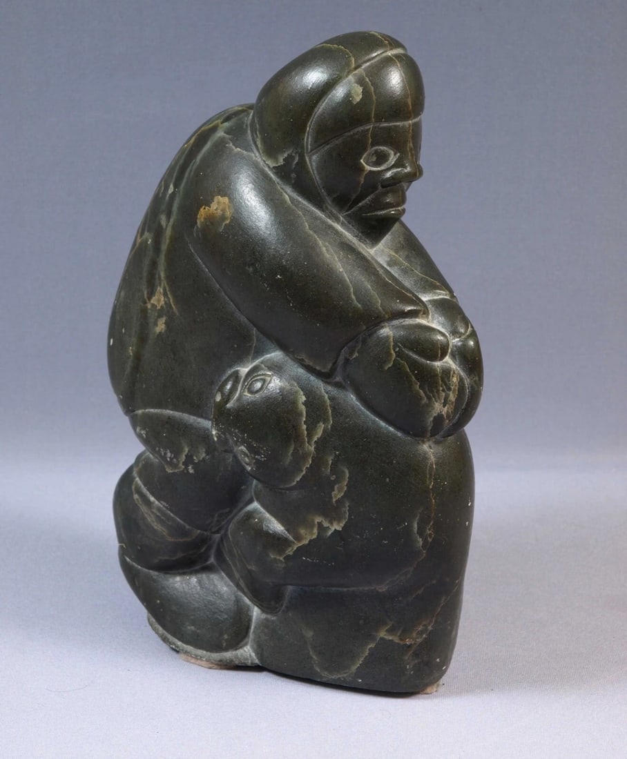 Inuit Eskimo Canada Native American Soapstone Carving Man Seal 13lb 1979: This is a vintage Primitive Native American Eskimo Figurine. The figurine is made from stone and it is very beautiful. It shows a man in a traditional outfit holding a seal. It is signed at the bottom