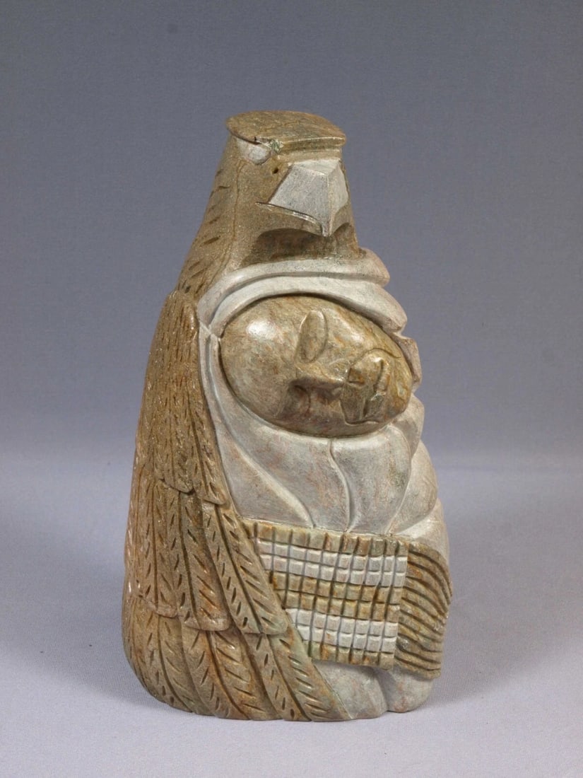 Native Iroquois Soapstone Carving EAGLE Face Totem SIGNED Neginedasah HEAVY: This is a vintage Primitive Native Canadian Figurine. It shows a face of native man with and eagle on top of it. The sculpture shows the connection between man and the nature. It is signed on the