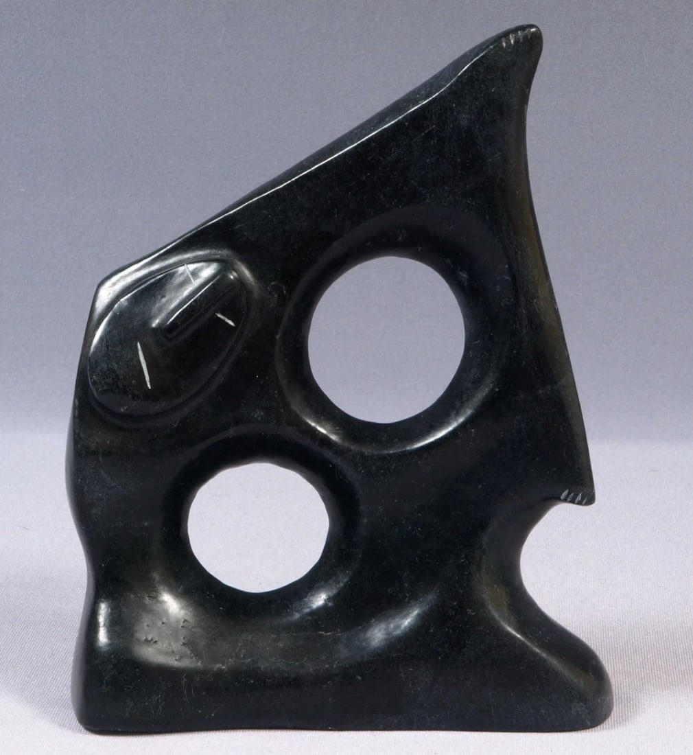 Native American Stone Carving Faces SIGNED Canada Willie Mukjungnik: This is a vintage Primitive Native American Figurine. It is signed on the bottom. It is made by Willie Mukjungnik from Arviat. It is rare and very beautiful. The carving is app. 8 1/2" tall. It is 6"