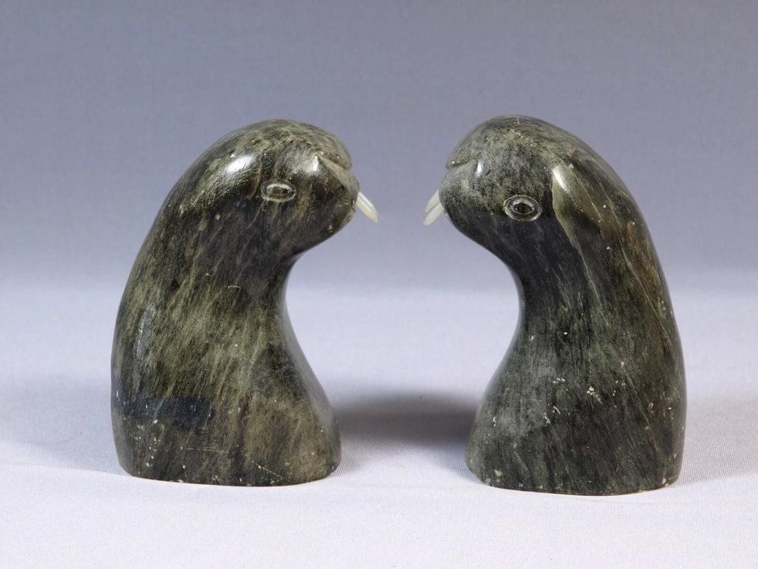 Canada Carving 2 Walrus Head Soapstone Large Bookends SIGNED Native: This is a set of vintage Soapstone Figurines. The figurines are made from soapstone. They are a matching pair of walrus heads and can be used as bookends or as nice display piece. The carving are
