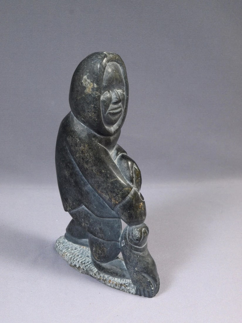 Signed Inuit Native American Soapstone Hunter Seal Canada SIGNED Sticker: This is a vintage Primitive Native American Eskimo Inuit Figurine. It is signed at the bottom. It is made in 1974 and has 'Canada Eskimo Art" sticker. The figurine is made from soapstone, it is