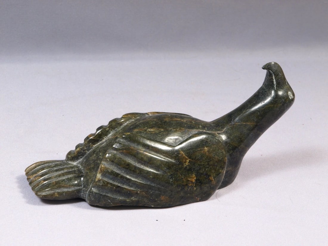 Inuit Eskimo Native Canada Soapstone Carving Goose Duck Signed Eskimo Sticker: This is a vintage Primitive Native American Eskimo Figurine. The figurine is made from stone and it is very beautiful. Ii is a figure of a goose or duck. It is signed at the bottom with sylables. It