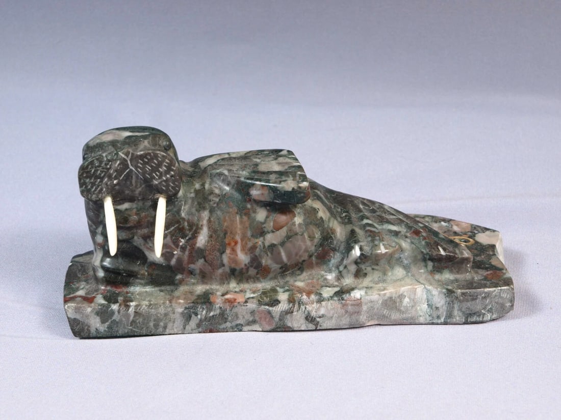 Inuit Native American Stone Carving Figurine Sea Lion Walrus Canada: This is a vintage Primitive Native American Walrus Figurine. The figurine is made from a stone and is very beautiful. I don't think it is a soapstone. It looks more like granite. It is app. 4" tall an
