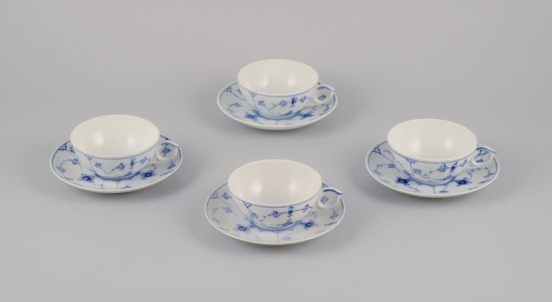 Royal Copenhagen Blue Fluted Plain. A set of four porcelain teacups with saucers. Approx. 1950 (1 of 9)