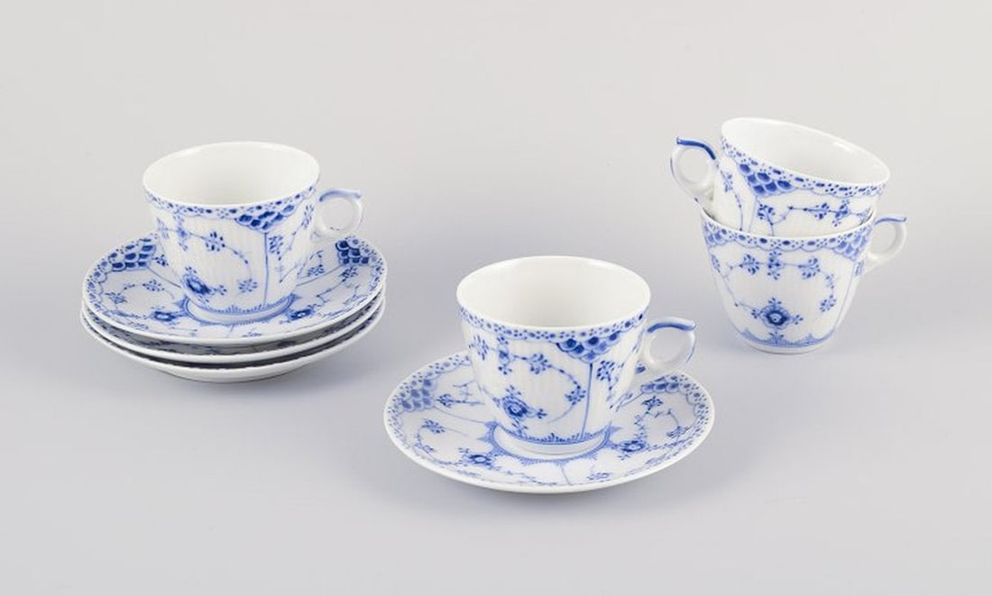 Royal Copenhagen Blue Fluted Half Lace. Four pairs of porcelain coffee cups and saucers. Approx: Royal Copenhagen Blue Fluted Half Lace, four pairs of coffee cups and saucers. Model number: 1/719. Dating: Approx 1940s. Marked. In perfect condition. First factory quality. One cup and saucer in sec