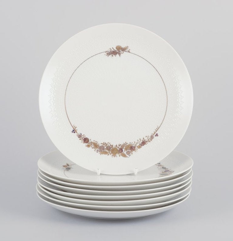 Bjørn Wiinblad for Rosenthal Studioline 362, Germany. A set of eight 'Romanze' breakfast plates: Bjørn Wiinblad for Rosenthal Studioline 362. A set of eight "Romanze" breakfast plates in porcelain. Hand-decorated in gold on a white base. 1960s/70s. Perfect condition, appears unused. Marked. 