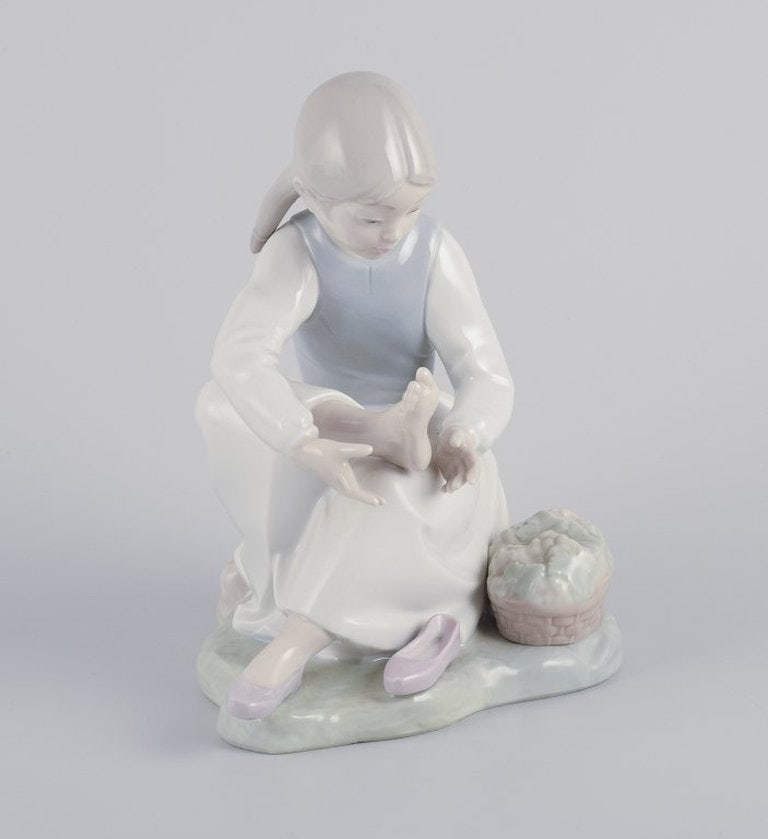 NAO, Spain. Porcelain figurine of a girl having a rest. Circa 1980s. - 3