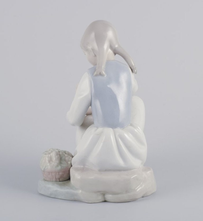 NAO, Spain. Porcelain figurine of a girl having a rest. Circa 1980s. - 5