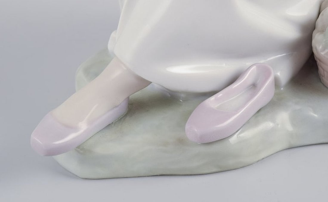 NAO, Spain. Porcelain figurine of a girl having a rest. Circa 1980s. - 7