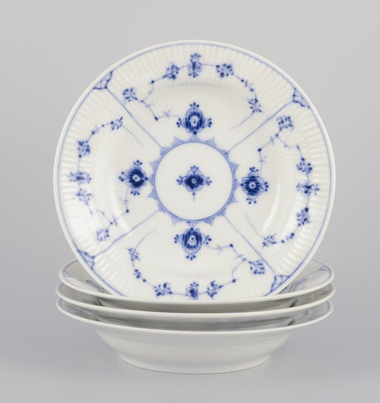 Bing & Grøndahl Blue Fluted. A set of four antique deep porcelain plates. 1898-1899. (1 of 6)