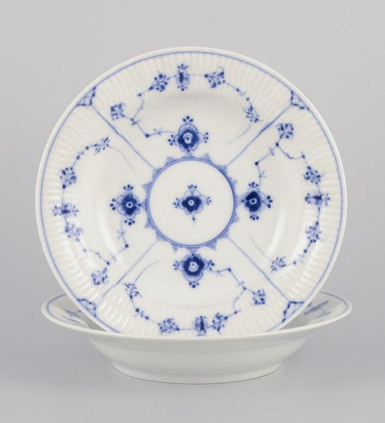 Bing & Grøndahl Blue Fluted. Two antique deep porcelain plates. 1898-1899.: Bing & Grøndahl Blue Fluted. Two antique deep plates. Hand-decorated in blue. Extra deep model. Early and rare mark from 1898-1899. Excellent condition with minimal signs of use. Dimensions: D 24