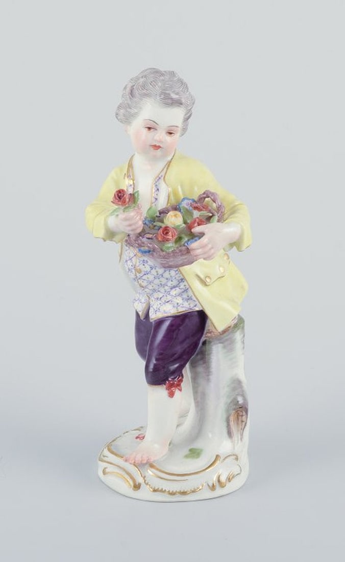 Meissen, Germany. Porcelain figurine of boy with basket of flowers. Ca. 1900. (1 of 9)