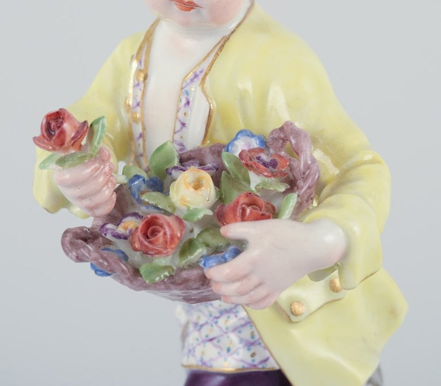 Meissen, Germany. Porcelain figurine of boy with basket of flowers. Ca. 1900. - 4
