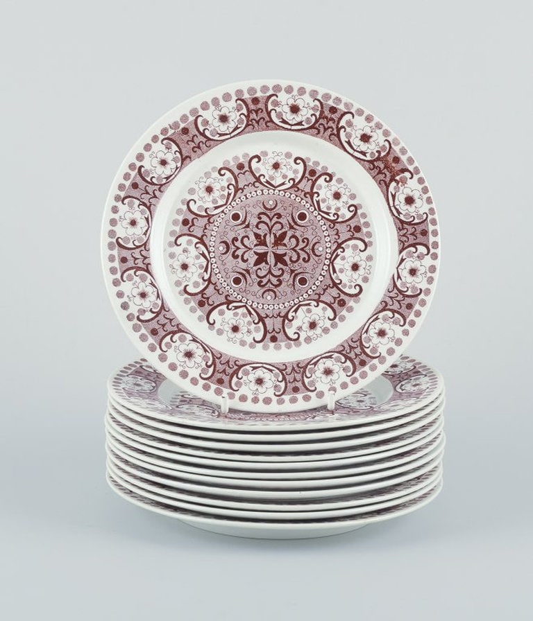 Raija Uosikkinen for Arabia, Finland. A set of twelve 'Ali' faience plates. Circa 1960.: Raija Uosikkinen for Arabia, Finland A set of twelve ‘Ali’ faience plates. Retro design. Circa 1960s. In excellent condition, with minimal signs of use. Marked. Dimensions: D 17.3 cm.;