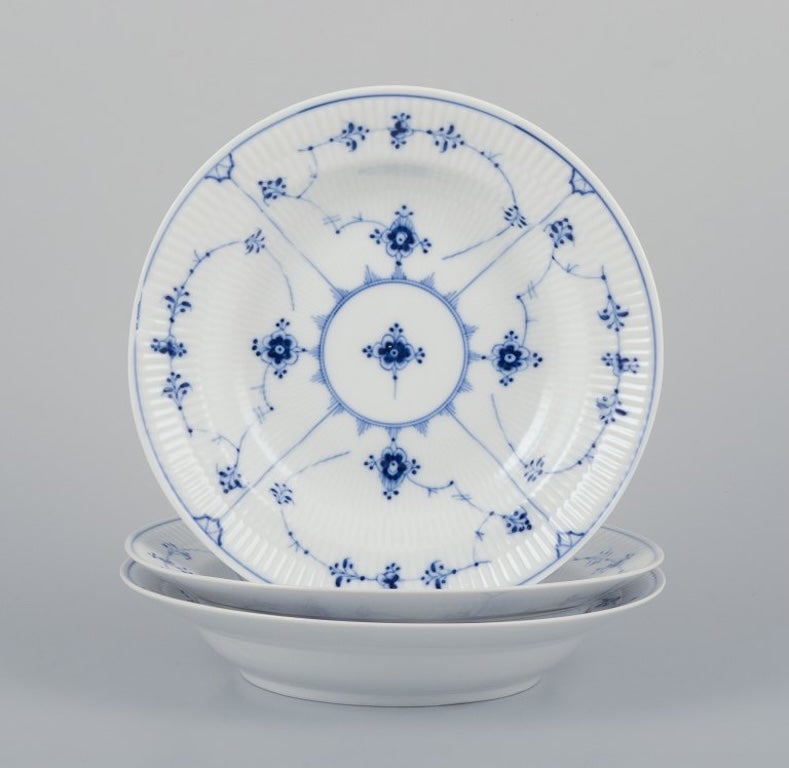 Royal Copenhagen Blue Fluted Plain. Three deep plates in porcelain. 1954. (1 of 9)