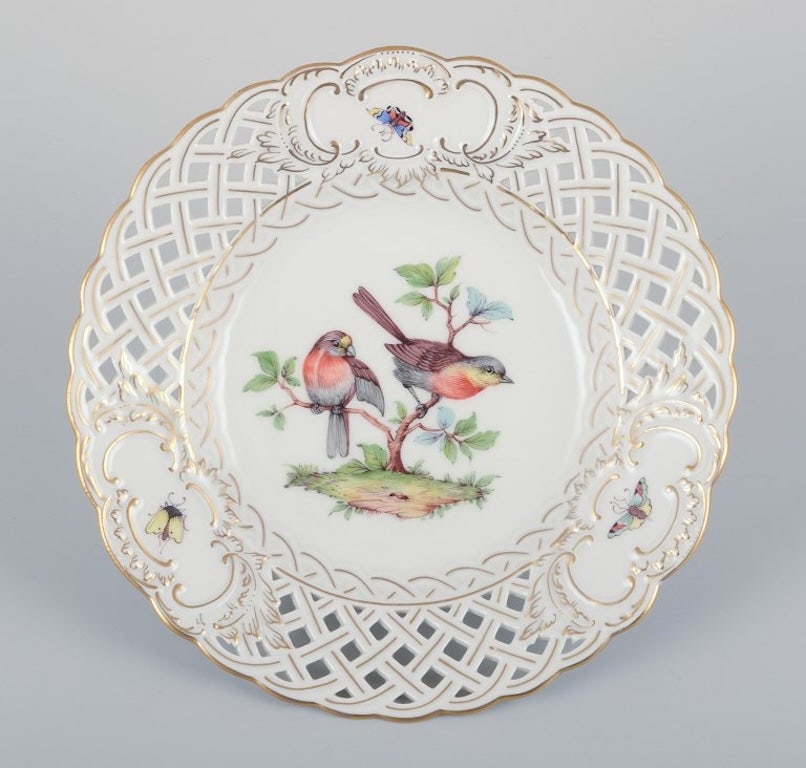 Meissen, Germany. Open lace porcelain plate. Hand-painted with a bird motif and insects, gold trim.: Meissen, Germany. Open lace porcelain plate. Hand-painted with a bird motif and insects, gold trim. Ca. 1900. Marked. Perfect condition. Appears unused. Fifth factory quality (for no obvious reason). 