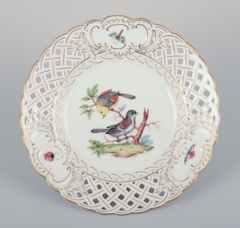 Meissen, Germany. Open lace porcelain plate. Hand-painted with a bird motif and insects, gold trim. (1 of 8)