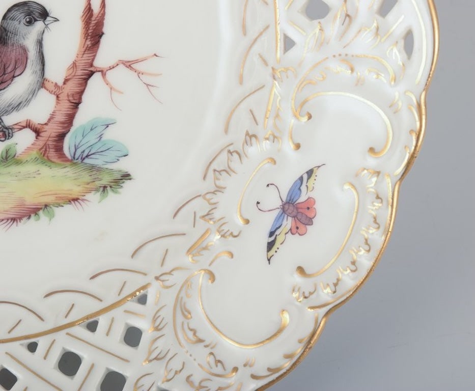 Meissen, Germany. Open lace porcelain plate. Hand-painted with a bird motif and insects, gold trim. - 6