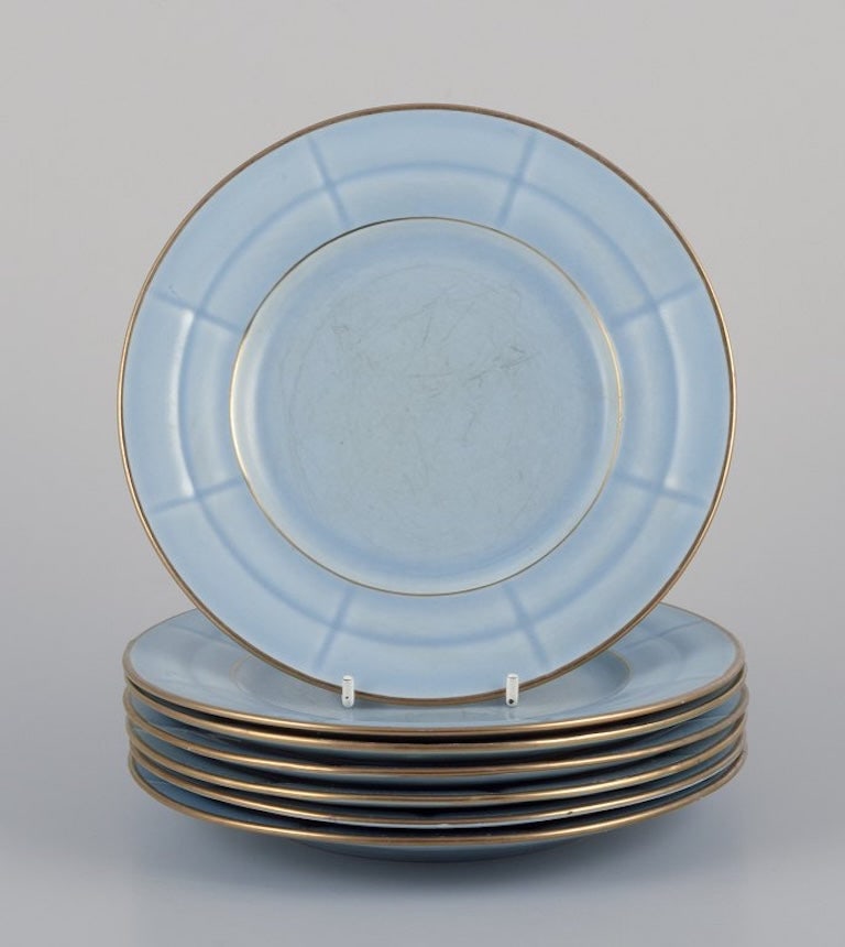 Arthur Percy for Gefle, Sweden. Seven Art Deco 'Grand' plates in pastel blue porcelain with: Arthur Percy for Gefle, Sweden. Seven Art Deco "Grand" plates in pastel blue porcelain with hand-painted gold trim. 1930s/1940s. In good condition, with signs of wear in the form of scratches and craz