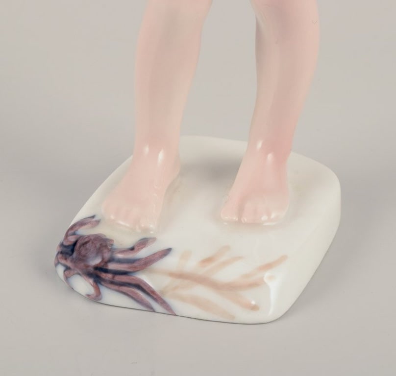Bing & Grøndahl, Denmark. Porcelain figurine of a boy and crab. Mid-20th century. - 4