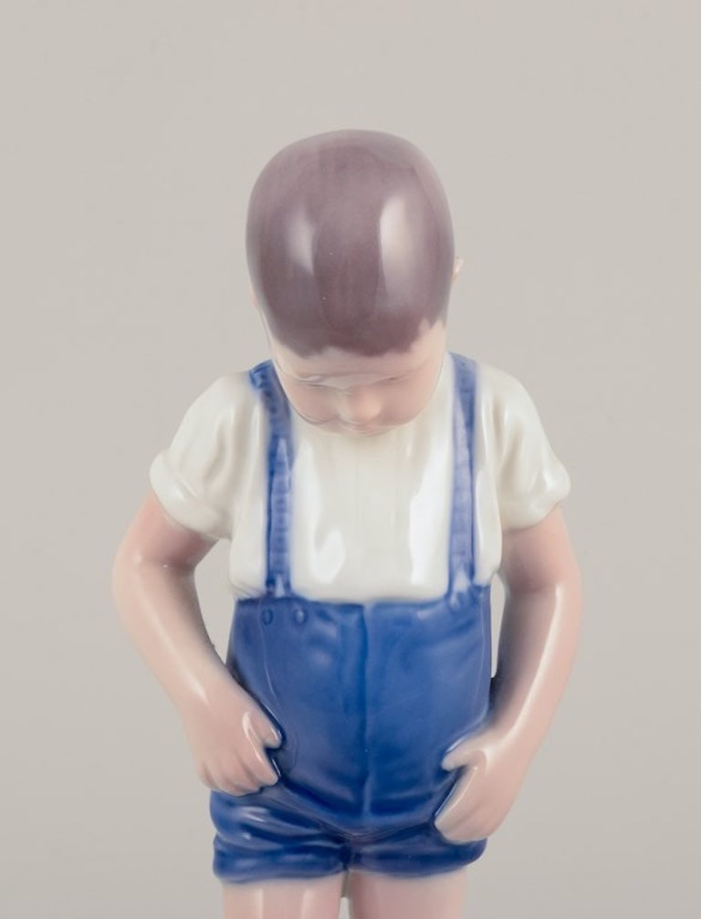 Bing & Grøndahl, Denmark. Porcelain figurine of a boy and crab. Mid-20th century. - 6